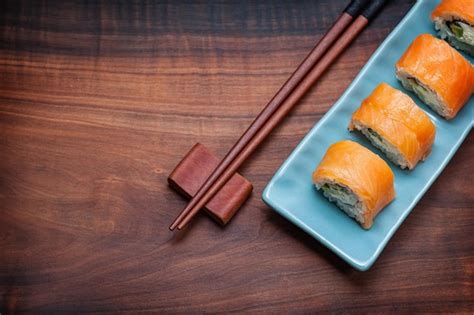 Sushi philadelphia rools on wooden background | Premium Photo