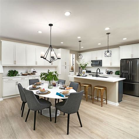 Open Concept Kitchen & Dining Room with Modern Black Lighting