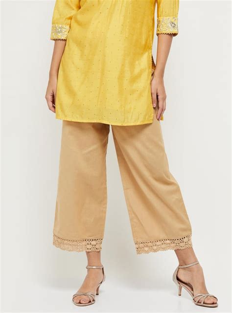 Buy Women Solid Drawstring Closure Flared Pants Online at just Rs. 599. ...