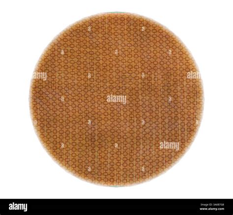 A round surface featuring a textured, honeycomb pattern in warm, earthy ...