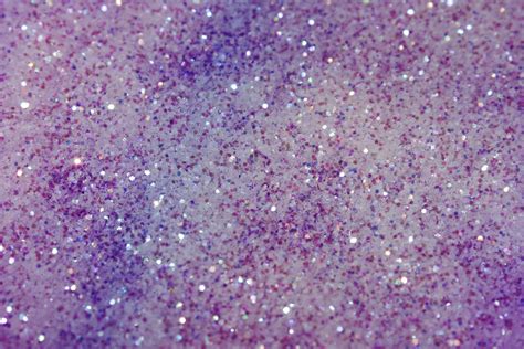 Download A Close Up Of A Purple Glitter Background | Wallpapers.com