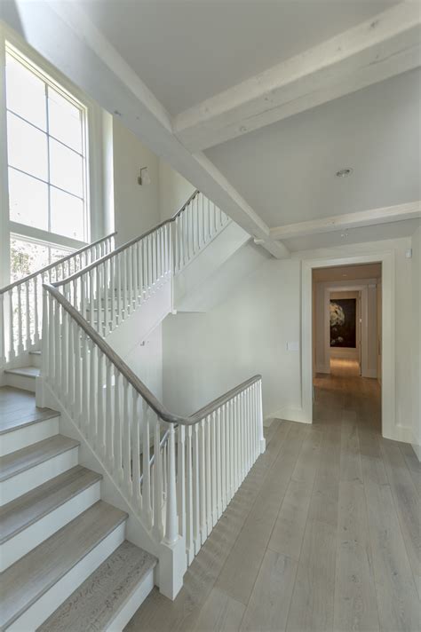 Custom Designed staircase with stained oak hand railing. Floors ...