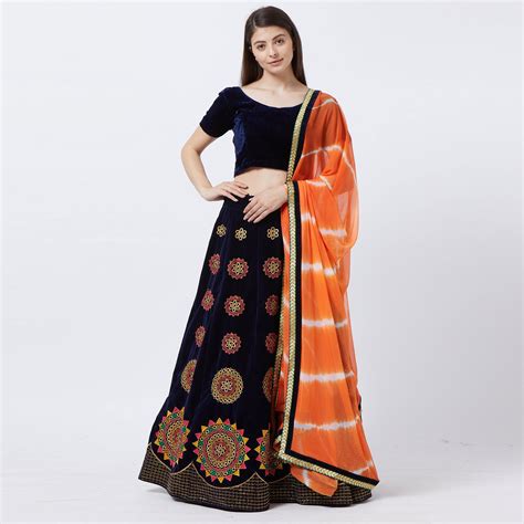 Entrancing Navy Blue Colored Partywear Embroidered Velvet Lehenga Choli