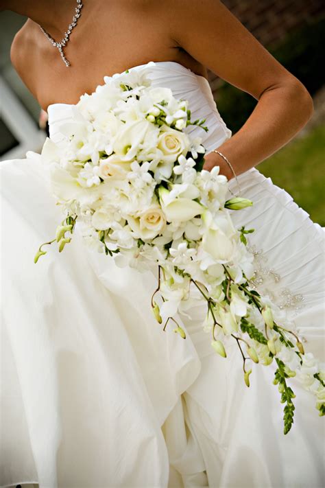 Cascading style bouquet with calla lilies, dendrobium orchids, roses ...