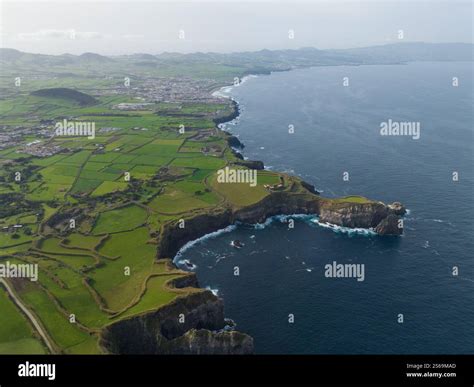 green grassland and rock land landscape of the Azores islands in the Atlantic ocean, touristic ...