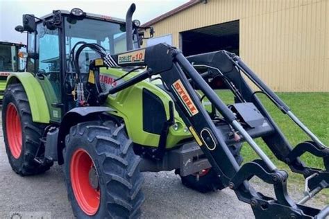 Sehr gepflegt mit Stoll-Frontlader: Claas Axos 310 Traktor für 33.915 ...