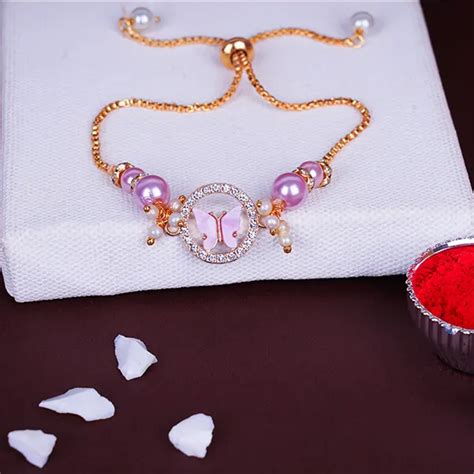 Send Pink Butterfly Bliss Lumba Rakhi Online | Rakhibazaar.com