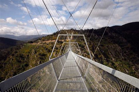 People walk on the world's longest pedestrian suspension bridge '516 ...