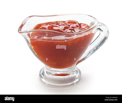 Red chinese spicy sauce in a transparent gravy boat Stock Photo - Alamy