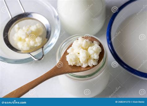 Kefir Fermented Milk Drink with Kefir Grains. Homemade Kefir Stands in a Glass, Next To Kefir ...