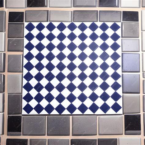 Premium Photo | A blue and white square tile with black squares on it.