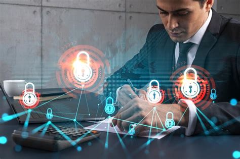A man in office taking notes using phone and financial safety lock ...