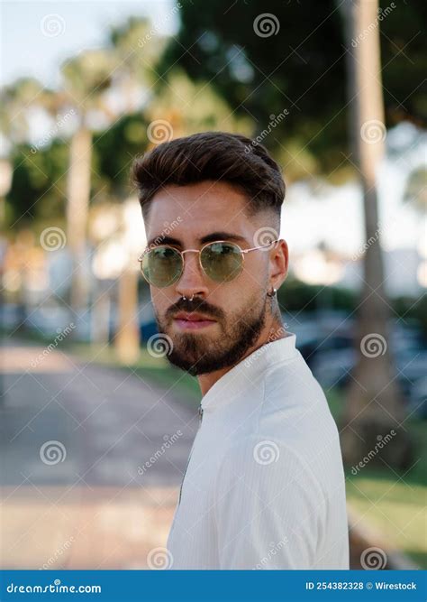 Young Spanish Handsome Man with a Stylish Hairstyle, Tattoos, and Sunglasses Stock Photo - Image ...