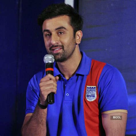 Rishi Kapoor speaks as Ranbir Kapoor looks on during the logo launch of ...