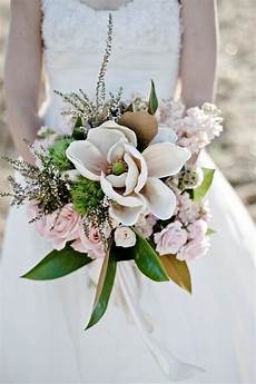 Magnolia Flowers For Weddings by This Wedding Bouquet With A Magnolia In The Center Magnolia Flowers For Weddings