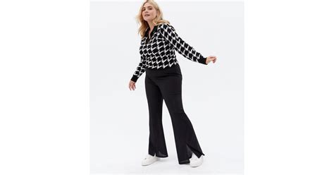 Curves Black Ribbed Split Front Flared Trousers | New Look