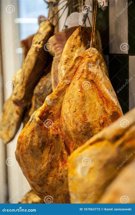 Rows of Dried Italian Dried Ham in Butchers Shop Stock Photo - Image of ...