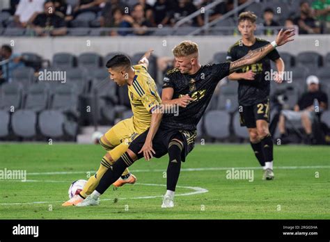 LAFC midfielder Mateusz Bogusz (19) challenges Real Salt Lake forward ...