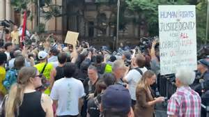 Police intervene as protesters gather near Town Hall in Sydney, Australia