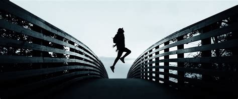 Download wallpaper 2560x1080 silhouette, jump, dark, railing, fence ...