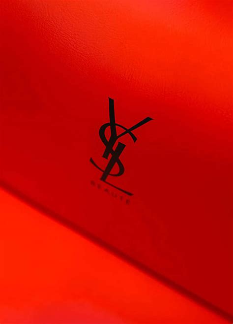Download The iconic Yves Saint Laurent insignia, making fashion history | Wallpapers.com