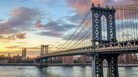 Manhattan Bridge over East River at sunset, New York City, USA ...