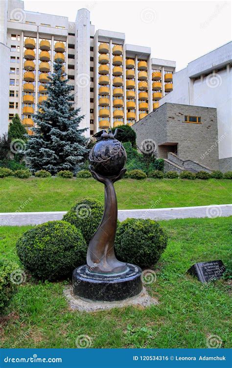 Modern Monument is a Hand that Holds the Planet Earth in the Courtyard ...