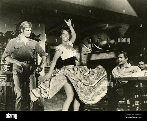 English actor Roger Moore and actress Leticia Roman in the movie Gold ...