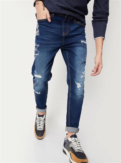 Buy Men Distressed Carrot Fit Jeans Online at just Rs. 1599.0 ...