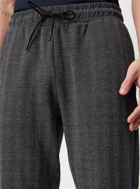Buy Men Herringbone Skinny Fit Athleisure Track Pants Online at just Rs ...