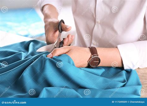 Tailor Cutting Fabric at Table in Atelier Stock Image - Image of ...