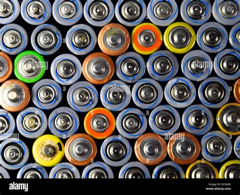Salt and alkaline batteries, source of energy for portable technology. AAA and AA batteries ...