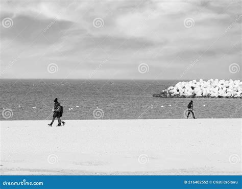 Black and White Picture with People Walking in Opposite Directio Stock ...