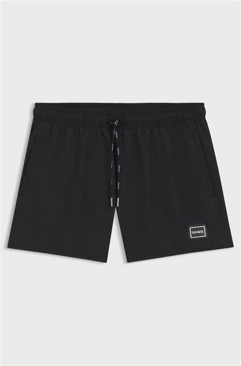 HUGO - Swim shorts with metal logo and branding