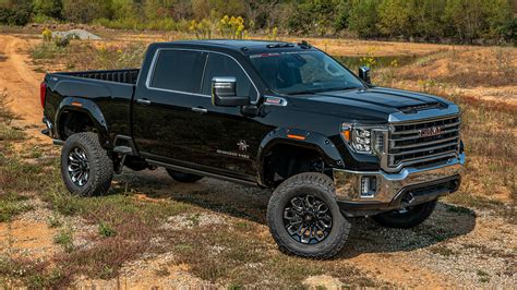 GMC BLACK WIDOW LIFTED TRUCKS — SCA Performance | Black Widow Lifted Trucks