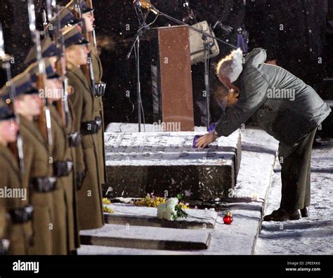 U.S. Vice President Dick Cheney sets a candle onto the memorial in the ...