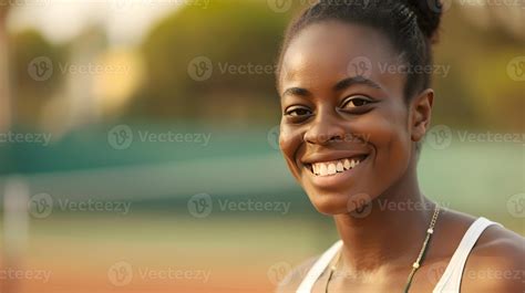 AI generated Smiling black female tennis player on the field ...