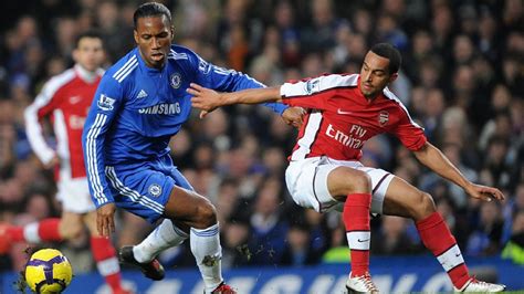 Chelsea legend Didier Drogba keeps Theo Walcott in check after Arsenal ...