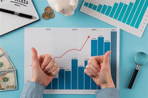 Top view of business items with growth chart and hands giving thumbs up ...