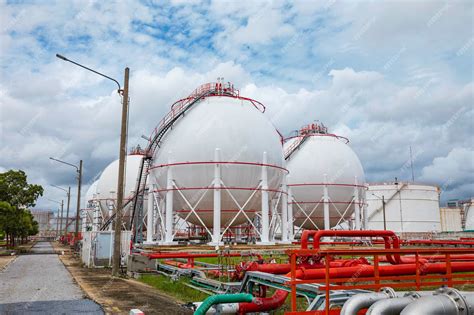Premium Photo | White spherical propane pipeline tanks containing fuel ...