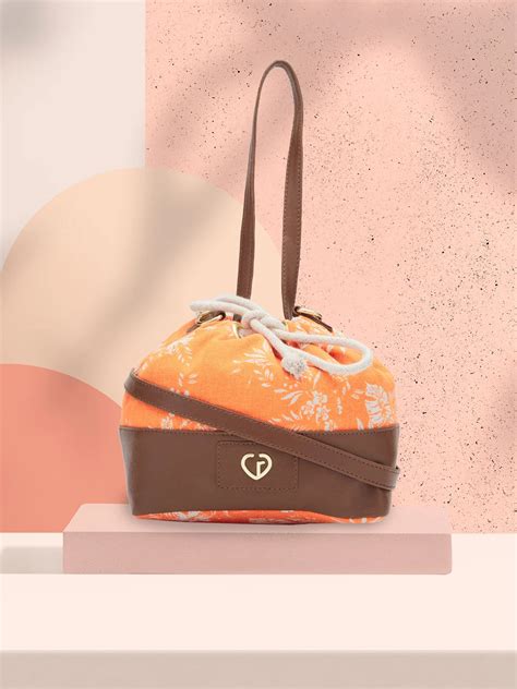 Buy Caprese Kendall Large Orange Sling Bag @ 599 | Caprese Bags