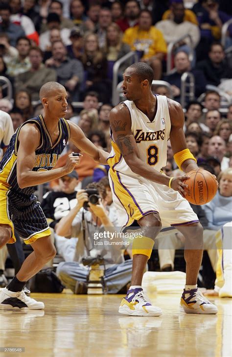 Kobe Bryant of the Los Angeles Lakers is defended by Reggie Miller of ...