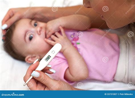 Sick Baby Being Checked for Illness. Stock Image - Image of person, healthcare: 33731007
