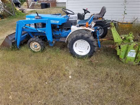 Image result for Ford 1210 Compact Tractor