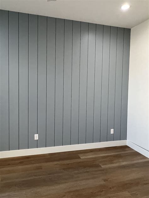 Easy DIY Vertical Shiplap Wall Installation