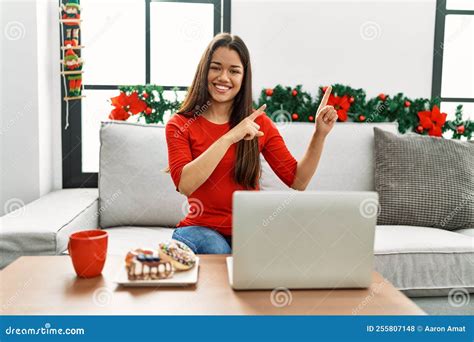 Young Brunette Woman Using Laptop Sitting on the Sofa on Christmas ...