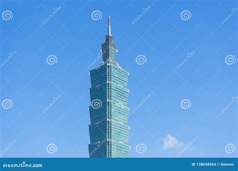 Photo of Taipei 101 tower against a blue sky.