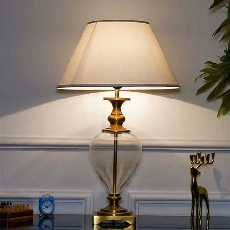 HINTON Clear Glass And Brass Finish Metal Table Lamp With Cotton White ...