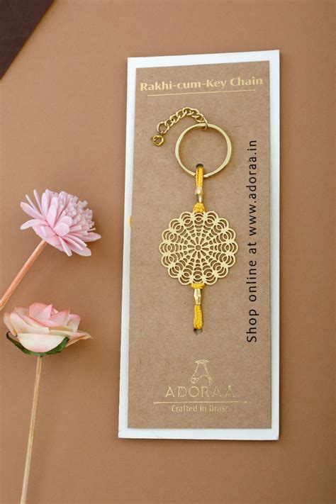Floral design Rakhi cum keychain ring for Bhai/brother crafted in bras ...
