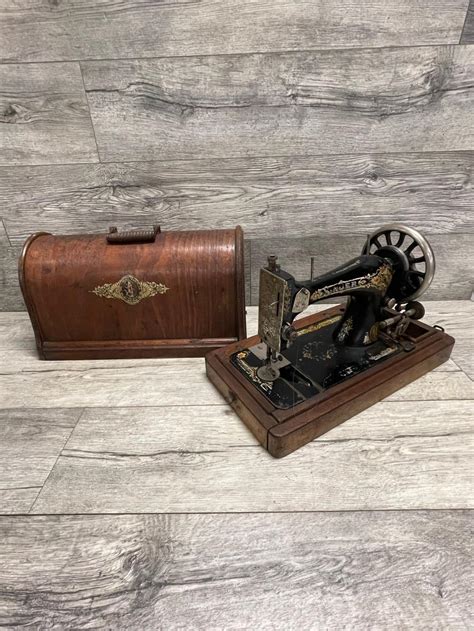 Image result for Hand-Cranked Sewing Machine